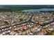 An aerial view of a community with access to waterways, showing numerous homes in a desirable location at 9000 Us Highway 192 # 115, Clermont, FL 34714