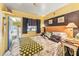 Comfortable bedroom featuring a bed, vintage décor, natural light, and convenient exterior access at 9000 Us Highway 192 # 115, Clermont, FL 34714