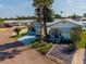 Charming single-story home featuring meticulously landscaped yard and a covered patio for outdoor relaxation and curb appeal at 9000 Us Highway 192 # 115, Clermont, FL 34714