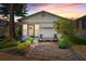Charming single-story home featuring a well-manicured front yard, vibrant plants, and covered porch seating at 9000 Us Highway 192 # 115, Clermont, FL 34714
