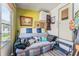 Relaxing living room features a comfortable sofa with decorative pillows and nature-themed paintings, inviting a sense of calm at 9000 Us Highway 192 # 115, Clermont, FL 34714