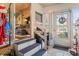 Enclosed porch featuring stairs, interior access, an eclectic mix of furnishings, and plenty of natural light at 9000 Us Highway 192 # 115, Clermont, FL 34714