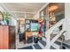 Enclosed porch featuring stairs, interior access, an eclectic mix of furnishings, and plenty of natural light at 9000 Us Highway 192 # 115, Clermont, FL 34714