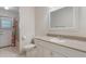 Bright, updated bathroom with white cabinets, tile floors, and a walk-in shower at 957 Yellow Rose Dr, Orlando, FL 32818