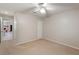 This bedroom is bright and open, with access to the living room through an open doorway at 957 Yellow Rose Dr, Orlando, FL 32818
