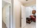 Hallway featuring neutral paint, tile floor, and doorways leading to other rooms in the home at 957 Yellow Rose Dr, Orlando, FL 32818