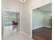 Spacious living room with tile floors, brick fireplace, and sliding glass doors leading to the patio at 957 Yellow Rose Dr, Orlando, FL 32818