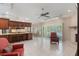 Open living space seamlessly connecting the kitchen, dining area, and living room with pool access at 957 Yellow Rose Dr, Orlando, FL 32818