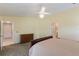 This main bedroom provides adjoining bath and closet access at 957 Yellow Rose Dr, Orlando, FL 32818