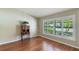 Bright office space with hardwood floors, plantation shutters, and a view of the lush landscaping at 957 Yellow Rose Dr, Orlando, FL 32818