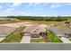 Expansive aerial view of single-story home, showcasing the well-manicured lawn and surrounding landscapes at 9846 Sw 106Th Ct Ocala, F, Ocala, FL 34481