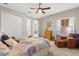 Comfortable bedroom featuring carpeted floors, neutral walls, and a comfortable bed at 9846 Sw 106Th Ct Ocala, F, Ocala, FL 34481