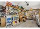 Organized garage with custom shelving, a workbench, and plenty of space for tools and storage at 9846 Sw 106Th Ct Ocala, F, Ocala, FL 34481