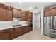 Stylish kitchen showcasing custom wood cabinets, stainless steel appliances, and modern countertops at 9846 Sw 106Th Ct Ocala, F, Ocala, FL 34481