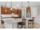 Bright kitchen island with quartz countertop, wood cabinets, and stainless steel appliances at 9846 Sw 106Th Ct Ocala, F, Ocala, FL 34481