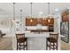Modern kitchen with a large island, pendant lighting, and stainless steel appliances at 9846 Sw 106Th Ct Ocala, F, Ocala, FL 34481