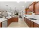 Open concept kitchen with stainless steel appliances, quartz counters and wood cabinets at 9846 Sw 106Th Ct Ocala, F, Ocala, FL 34481