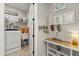 Functional laundry room with utility sink, washer and dryer, and decorative hooks at 9846 Sw 106Th Ct Ocala, F, Ocala, FL 34481