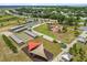 A great aerial view of the park with pickleball courts, basketball court, and playground at 9846 Sw 106Th Ct Ocala, F, Ocala, FL 34481