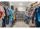Spacious walk-in closet with custom shelving and ample storage for clothes and accessories at 9846 Sw 106Th Ct Ocala, F, Ocala, FL 34481