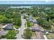 Aerial shot showcases a suburban street lined with well-maintained homes and mature trees at 10739 Lake Ralph Dr, Clermont, FL 34711