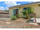 Backyard featuring banana tree and other tropical flora adjacent to the home at 10739 Lake Ralph Dr, Clermont, FL 34711
