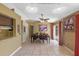 Well-lit dining room featuring neutral colors, decorative lighting, tile flooring, and sliding door access to the backyard at 10739 Lake Ralph Dr, Clermont, FL 34711