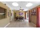 Well-lit dining room featuring neutral colors, decorative lighting, tile flooring, and sliding door access to the backyard at 10739 Lake Ralph Dr, Clermont, FL 34711