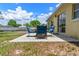 Back patio featuring sliding glass doors, patio, and furniture with a view of the backyard at 10739 Lake Ralph Dr, Clermont, FL 34711