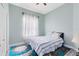 Bedroom with a light blue color scheme, a plush rug, and a ceiling fan at 10743 Fairhaven Way, Orlando, FL 32825