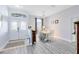 Bright and inviting foyer with tile flooring, leading to a dining area with hardwood floors and stylish décor at 10743 Fairhaven Way, Orlando, FL 32825