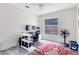 Bright office features a large window and a dark gray and red rug at 10743 Fairhaven Way, Orlando, FL 32825