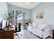 Office with modern decor, a window view, and comfortable seating at 10743 Fairhaven Way, Orlando, FL 32825