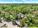 Aerial view of the community surrounded by lush landscaping with a community pool and ample parking at 109 Crown Oaks Way # 109, Longwood, FL 32779