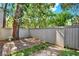 Private backyard area features a classic wood fence and mature trees and landscaping at 109 Crown Oaks Way # 109, Longwood, FL 32779