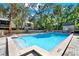 Sparkling community pool surrounded by beautiful mature trees and landscaping at 109 Crown Oaks Way # 109, Longwood, FL 32779