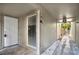 Hallway featuring a front door, window with blinds, and white stone at 109 Crown Oaks Way # 109, Longwood, FL 32779