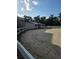 Equestrian arena with white fencing, sandy ground, and a stable building at 109 Crown Oaks Way # 109, Longwood, FL 32779