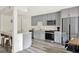 Bright kitchen featuring stainless steel appliances and gray cabinets at 109 Crown Oaks Way # 109, Longwood, FL 32779