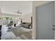 The naturally lit living room has a ceiling fan, neutral-toned furniture, and sliding glass doors at 109 Crown Oaks Way # 109, Longwood, FL 32779