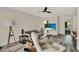 Comfortable living room featuring neutral tones, wood accents, and a flat-screen television at 109 Crown Oaks Way # 109, Longwood, FL 32779