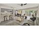 Open-concept living area with a modern kitchen and a dining area with sliding glass doors at 109 Crown Oaks Way # 109, Longwood, FL 32779