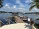 Picturesque lakefront dock with boat slips, wooden planks, and scenic water views with a gazebo at 1252 Lake Willisara Cir # Ge, Orlando, FL 32806