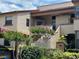 Charming townhome with colorful landscaping and a well-maintained facade offering curb appeal at 1252 Lake Willisara Cir # Ge, Orlando, FL 32806
