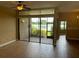 Bright living area with sliding glass doors leading to an outdoor patio with a lake view at 1252 Lake Willisara Cir # Ge, Orlando, FL 32806