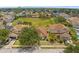 Aerial view of a neighborhood featuring well-manicured lawns and mature landscaping at 126 San Carlo Rd, Davenport, FL 33896