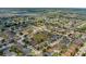 An aerial view showing the neighborhood with houses and streets at 126 San Carlo Rd, Davenport, FL 33896
