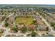 Beautiful aerial view of a neighborhood with well-maintained homes and green spaces at 126 San Carlo Rd, Davenport, FL 33896