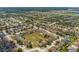 Aerial view of a large residential area with green trees at 126 San Carlo Rd, Davenport, FL 33896