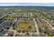 Aerial view of a residential community showcasing the layout of homes and green space at 126 San Carlo Rd, Davenport, FL 33896